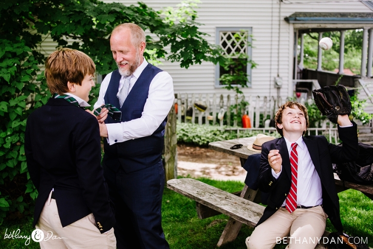 The groom helping his sons get ready