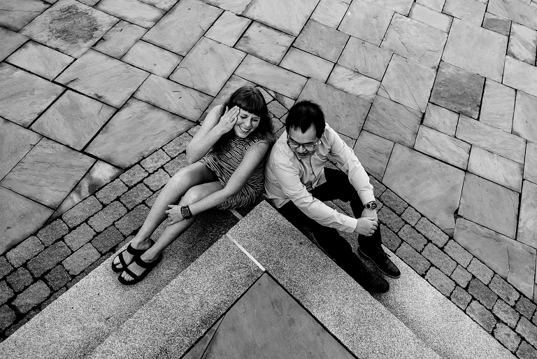 Couple giggling on steps in Portsmouth NH: Black and White Photo