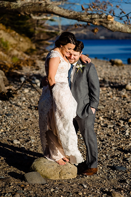 bride standing on a small rock so her and her groom are close in height