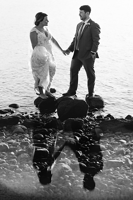 black and white photo of couple and their reflection