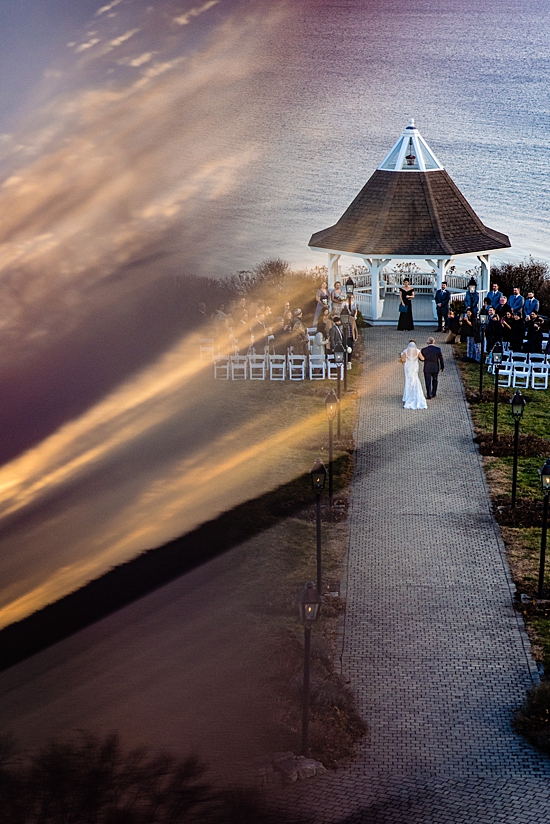 bride and father walking down the aisle photographed from a high vantage point