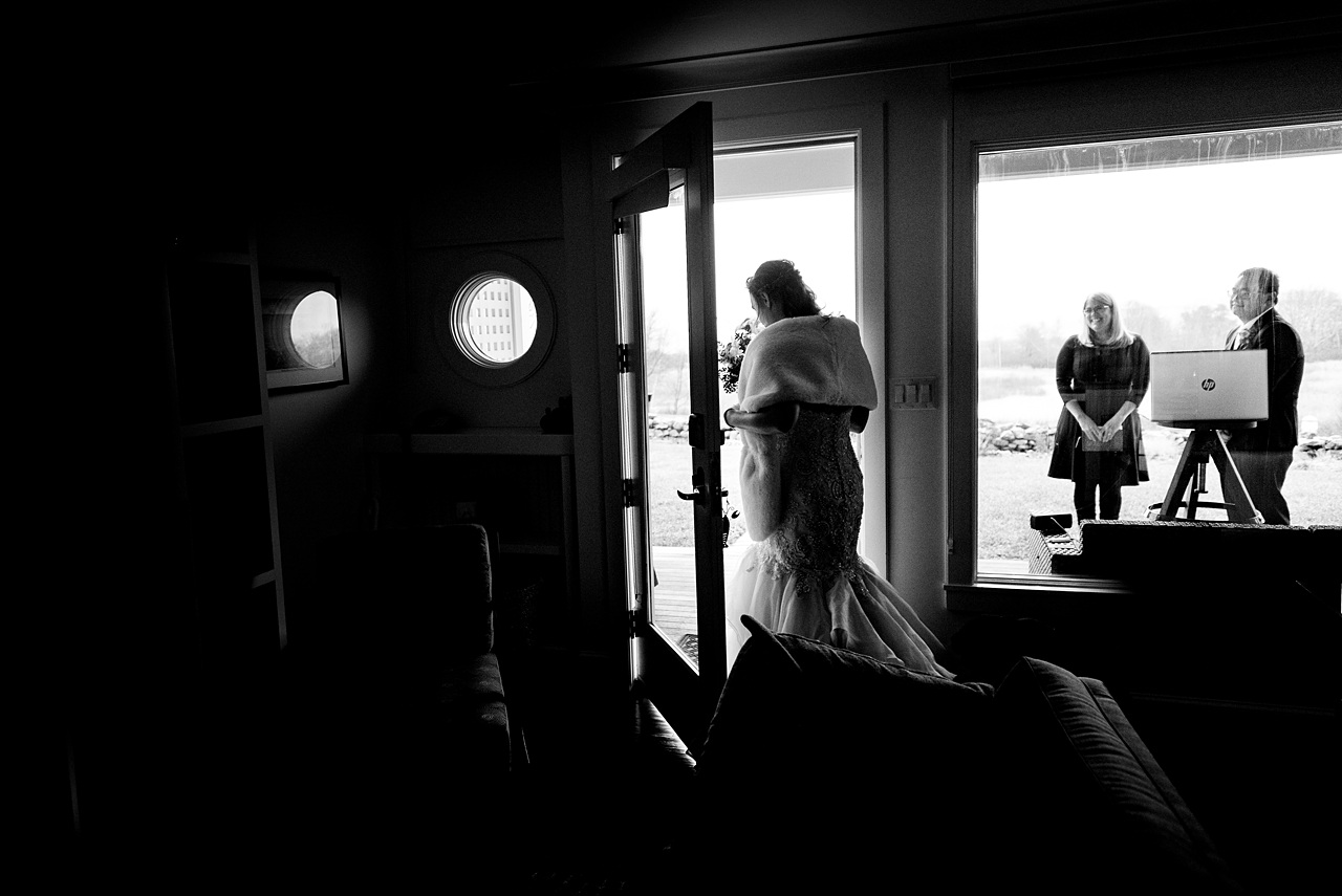 Bride coming out of the hotel room to head to her wedding ceremony.