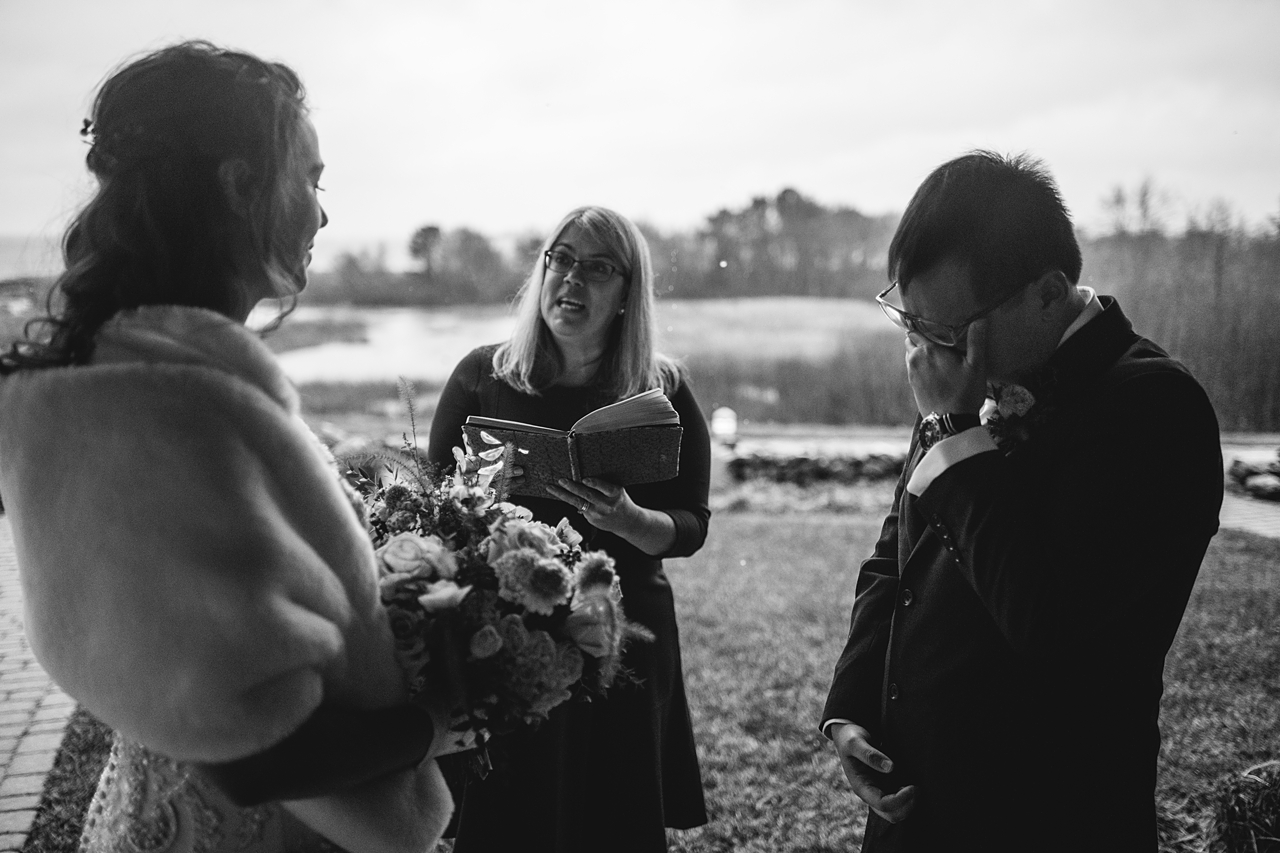 Groom crying during a wedding ceremony.