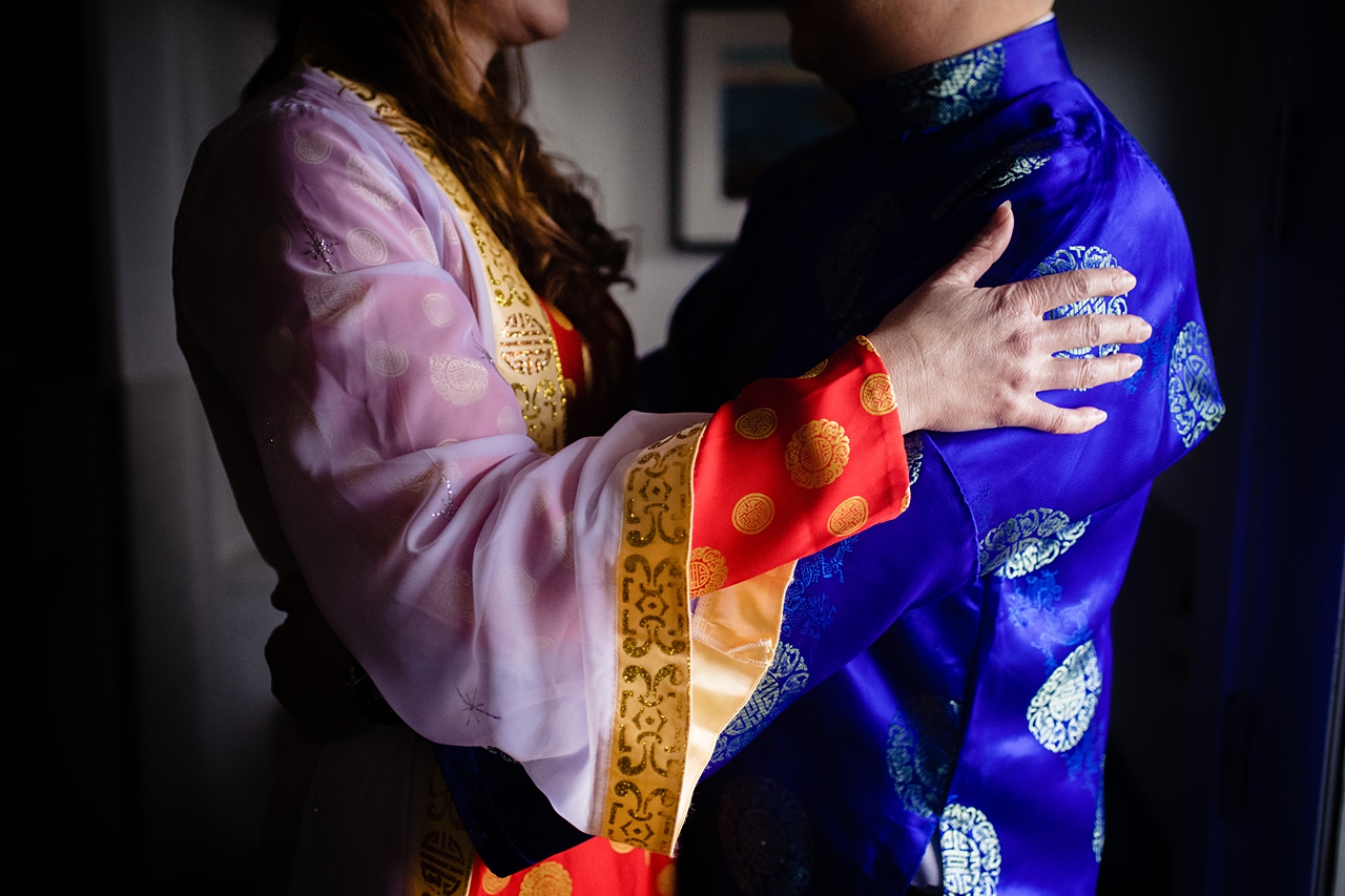 Wedding couple hugging.