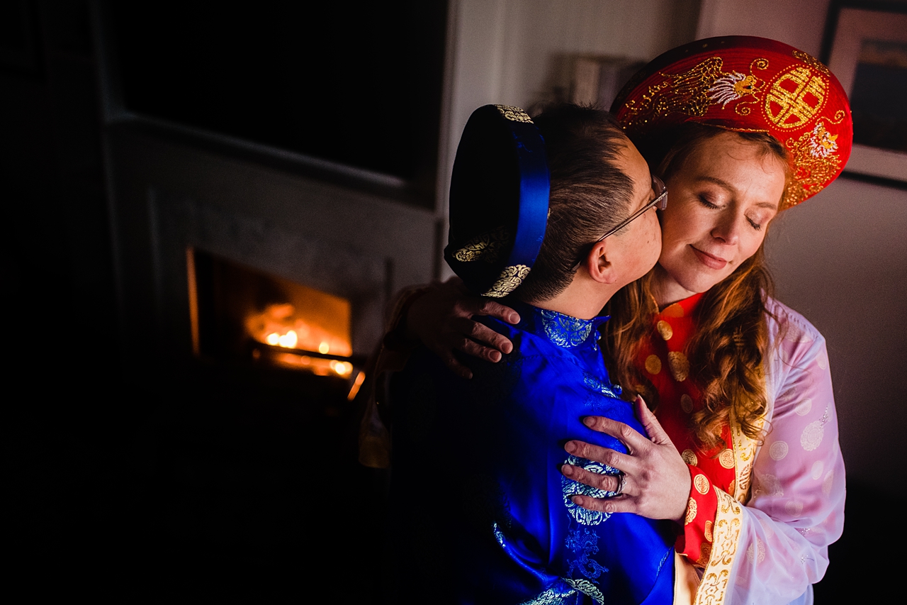 A kiss by the fire on a wedding day.